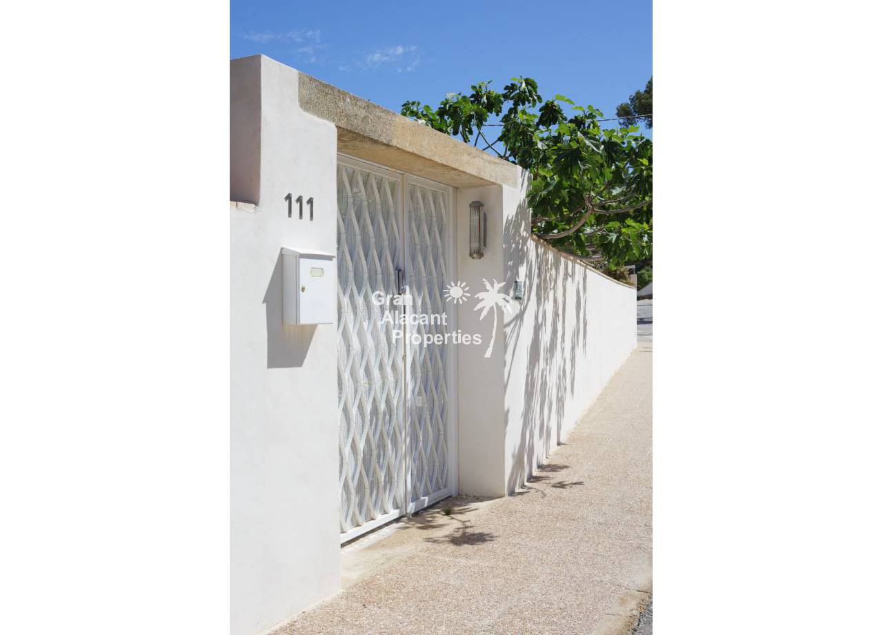 REF 20217 Albir mid-century modern villa gate from street